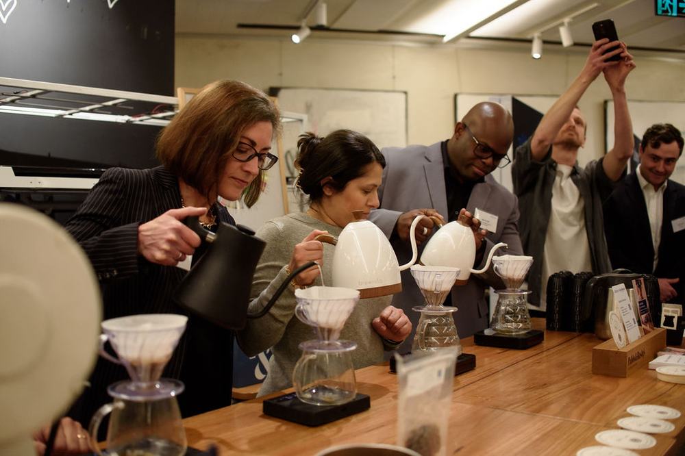 Guests at a coffee tasting at Kitchen by Mike
